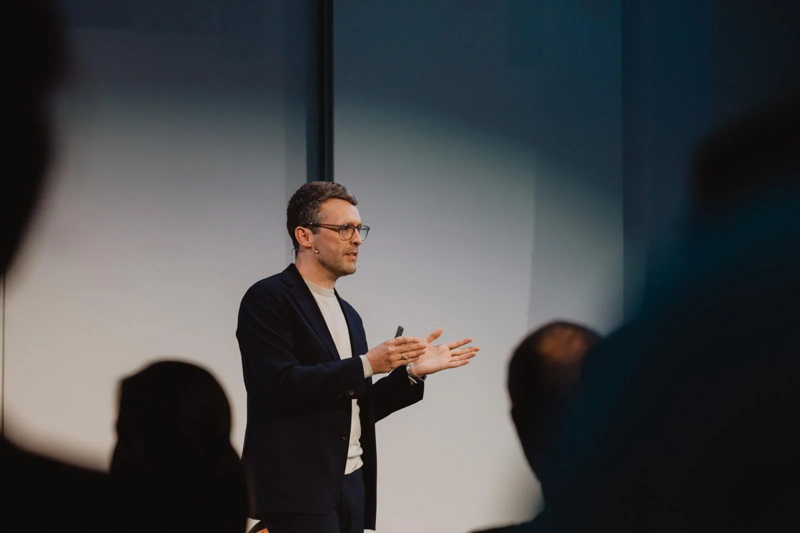 Dr Andreas W. Benecke giving a talk on stage